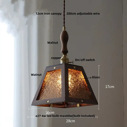Modern walnut wood pendant light with clear glass etched panels and copper accents for dining room lighting