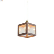 Modern walnut wood and clear glass pendant light with rustic brown wooden cube and brass-finished top for dining room