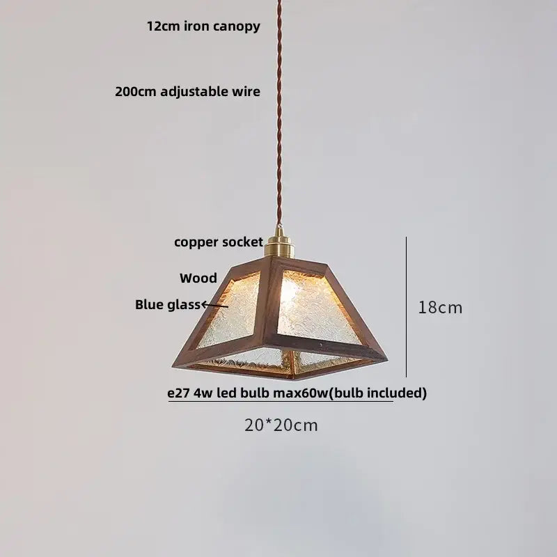 Modern walnut wood pendant light with dark wood frame, textured blue glass panels, and brass copper socket for dining room
