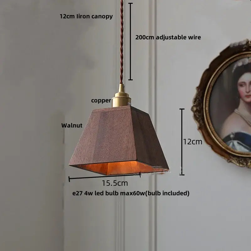 Modern walnut wood pendant light with clear glass cube shade and copper accent for dining room lighting