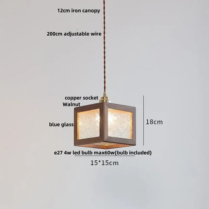 Modern walnut wood pendant light with clear blue textured glass panels and adjustable copper socket for dining room use