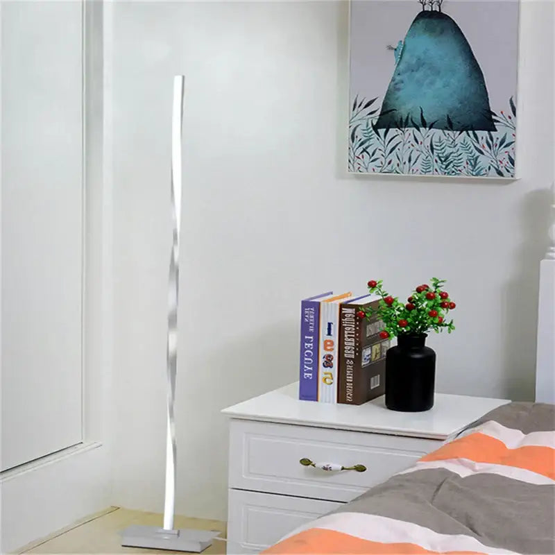 A sleek silver twisted decorbites dimmable led floor lamp with modern design for living room lighting