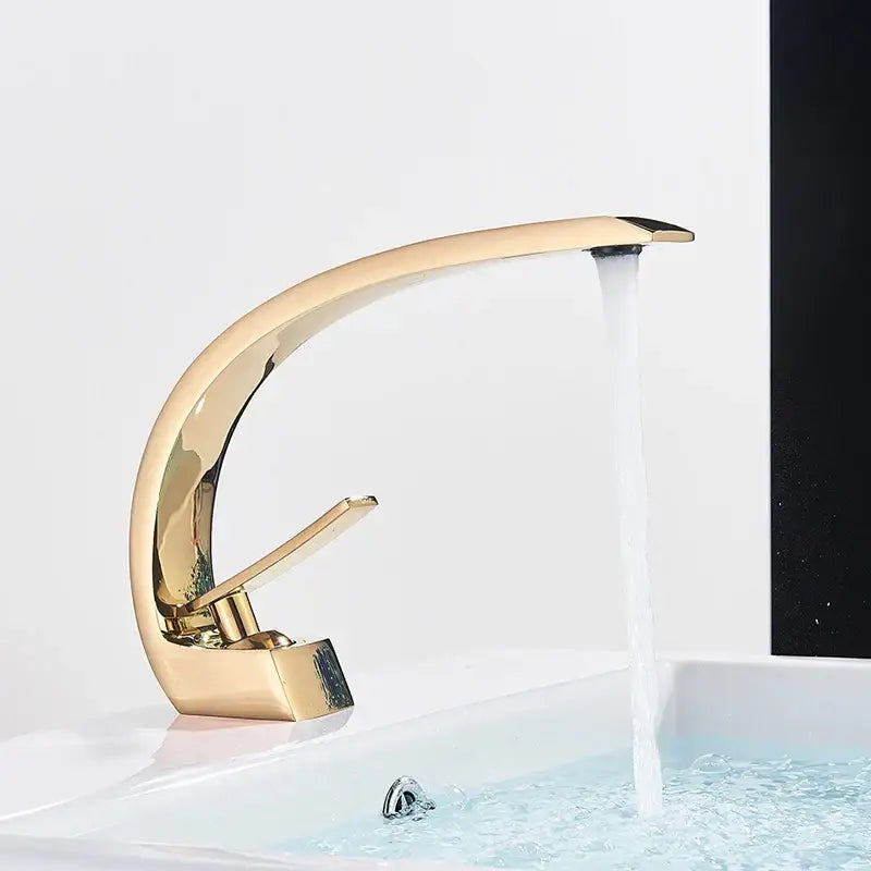Gold-toned sleekly curved basin faucet with modern polished metallic finish for decorbites black chrome bathroom mixer tap