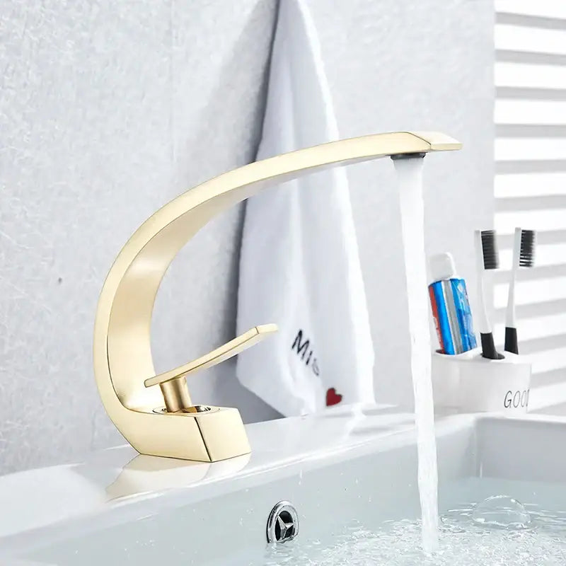 Gold-toned modern basin faucet with sleek curved spout and minimalist design for decorbites black chrome basin use