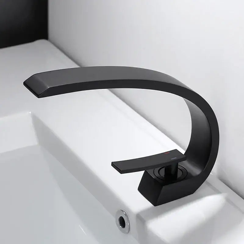 Modern black chrome basin faucet with sleek curved design and minimalist handle from decorbites black chrome collection