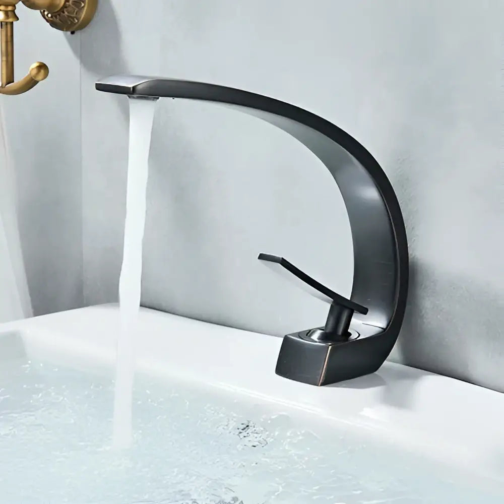Modern waterfall black chrome basin faucet with sleek curved design and matte finish by decorbites black chrome basin