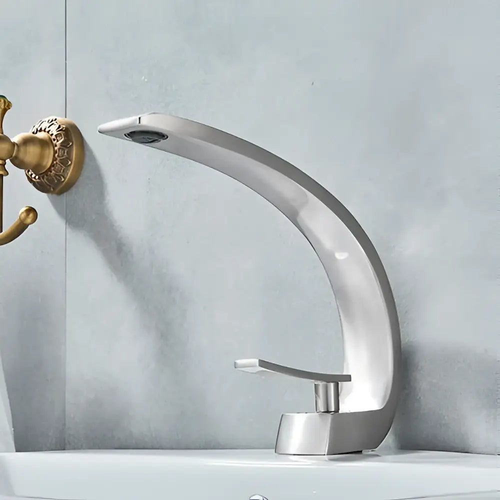 Modern silver basin faucet with sleek curved design and brushed metal finish for decorbites black chrome basin use