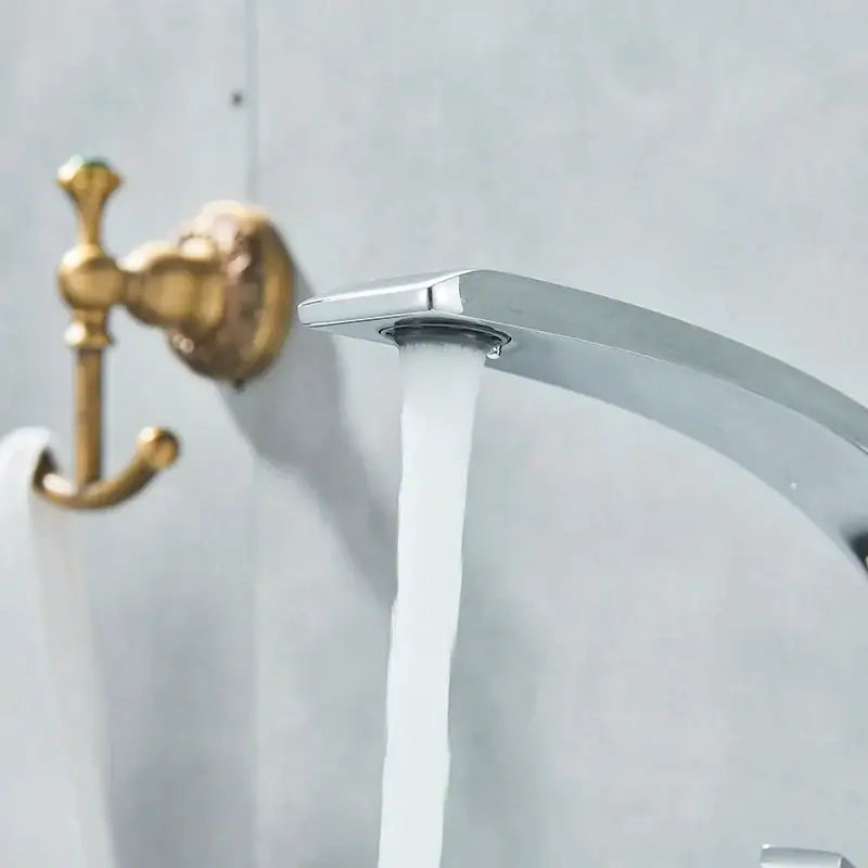 Modern waterfall black chrome basin faucet with sleek curved design and flowing water stream decorbites black chrome basin faucet