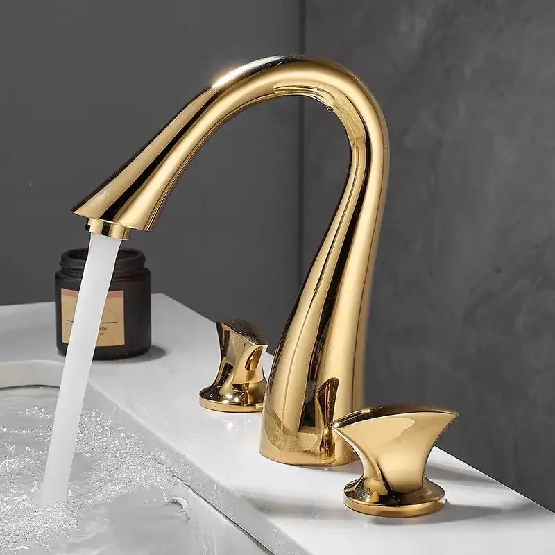 Modern waterfall black and gold basin faucet with a sleek curved design and polished metallic finish by decorbites black