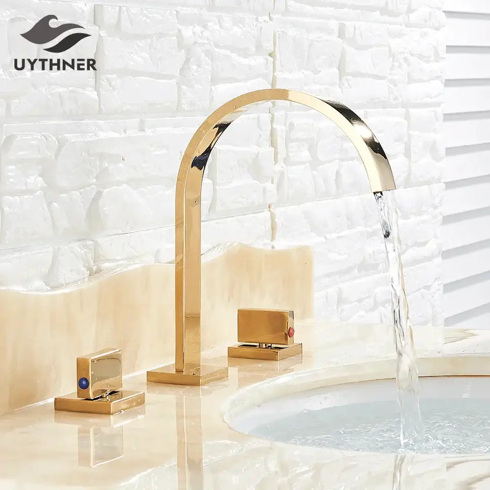 Modern waterfall dual handle gold basin faucet with sleek arched spout and blue accent decorbites dual handle design
