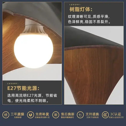 A warm glowing e27 led bulb with a smooth white finish in a modern wave black and bronze chandelier pendant light
