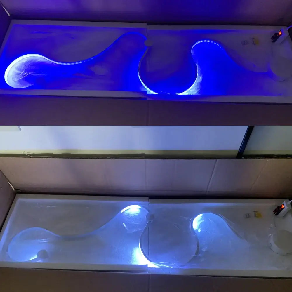 Blue led wall lights with flowing wave design embedded in translucent resin for modern living room decor