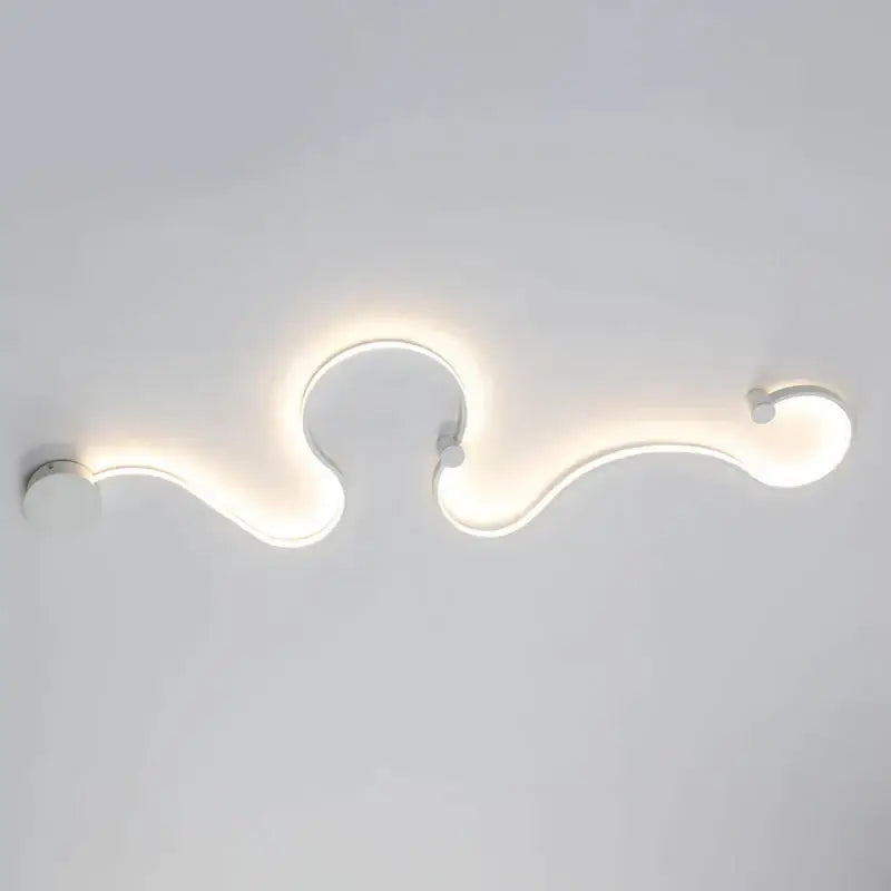 Modern white led wall light with sleek curved design and soft glowing illumination for stylish living room decor