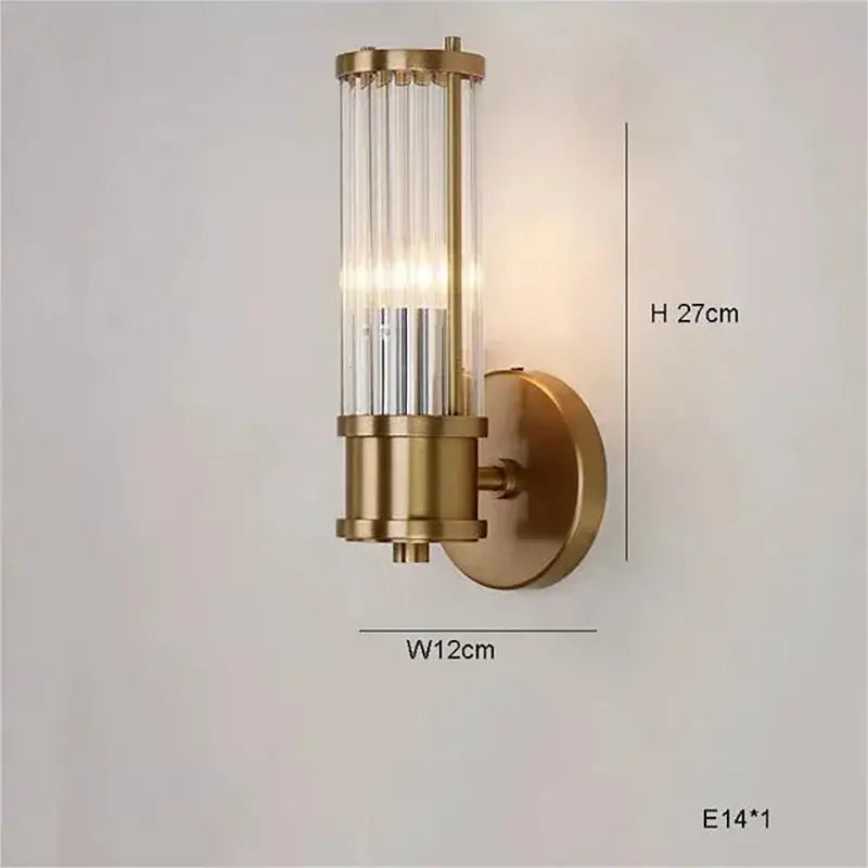 Brass-finished decorbites golden chandelier wall sconce with vertical glass tubes and circular mounting plate for living room