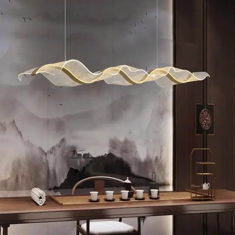 A modern wave glass elegant led pendant chandelier with translucent white mesh and gold accents for dining room