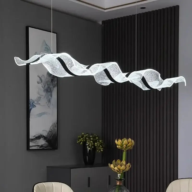 A modern wave glass elegant led pendant chandelier in translucent white with black accents for dining room lighting
