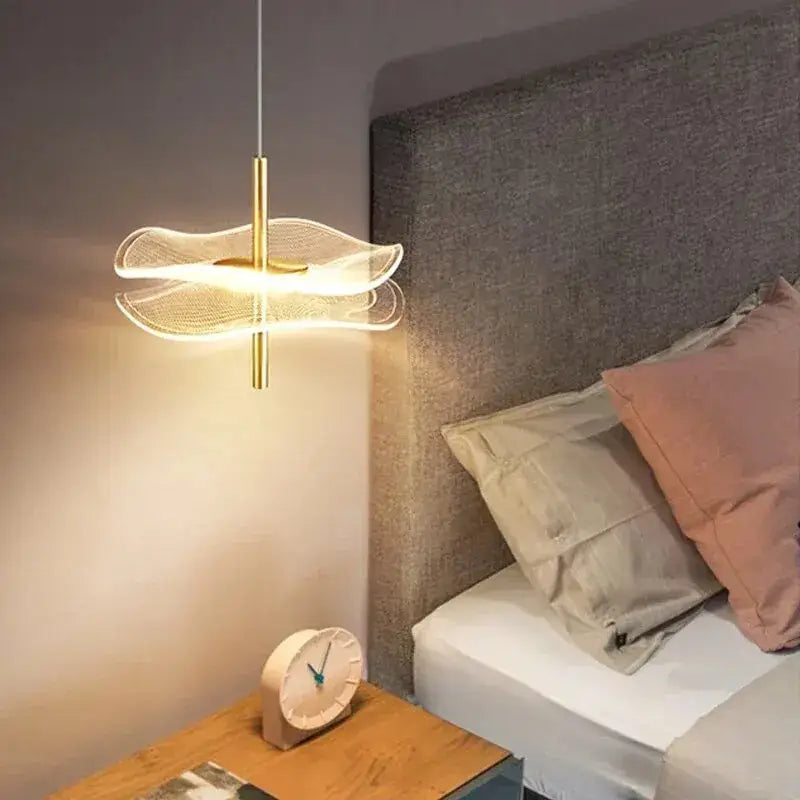 Gold-toned led pendant with modern flowing design and translucent wave glass shades for dining tables and living rooms