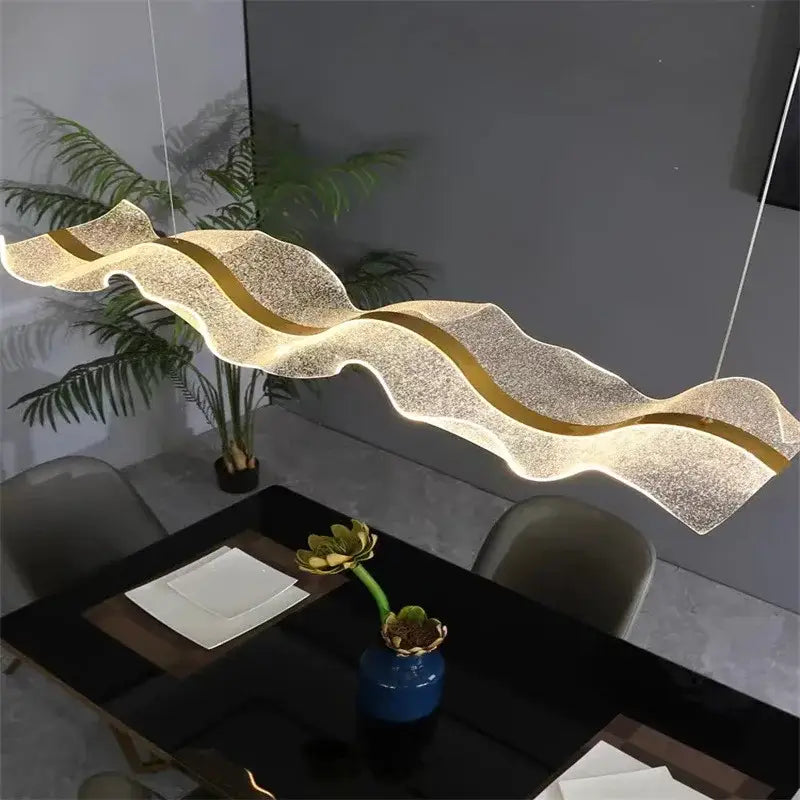 Modern wave gold acrylic led pendant light features a shimmering translucent design ideal for dining room decorbites pendant lights