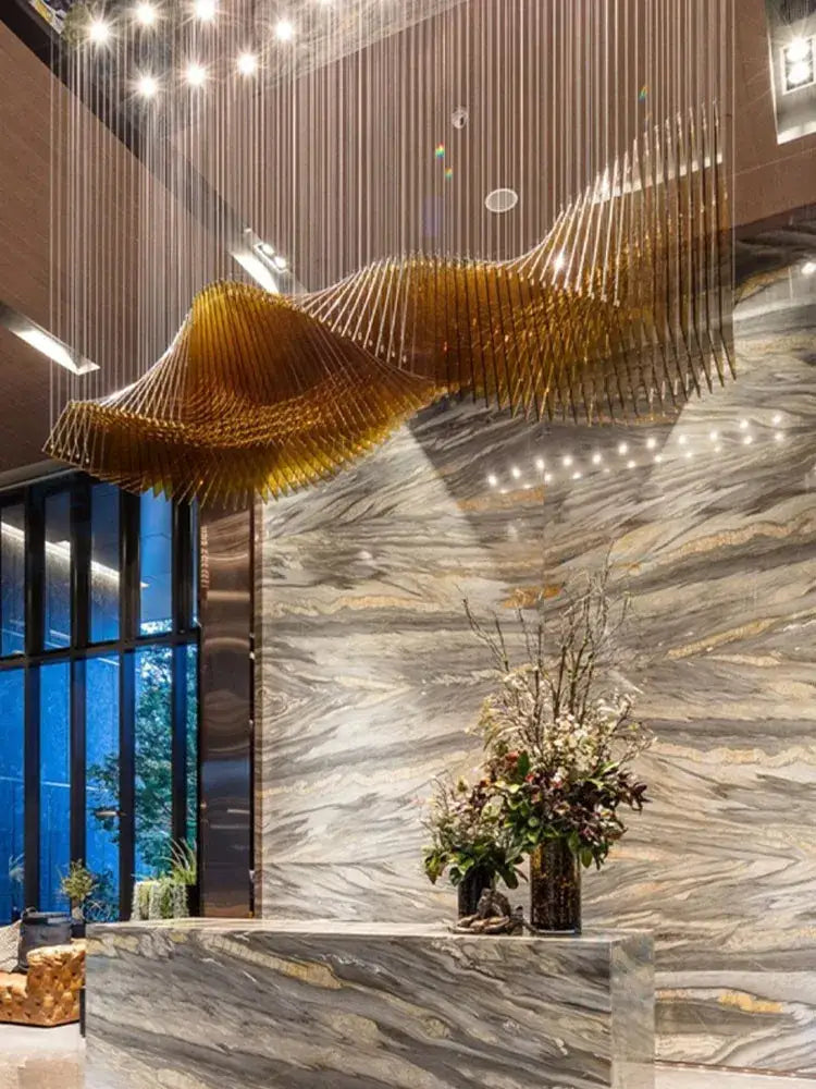 Modern wave golden designer chandelier with sleek metallic finish by decorbites designer for dining room decor