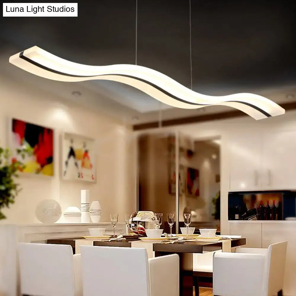 Modern white and black wavy led pendant light fixture made of acrylic material for chic dining ambiance by DecorBites