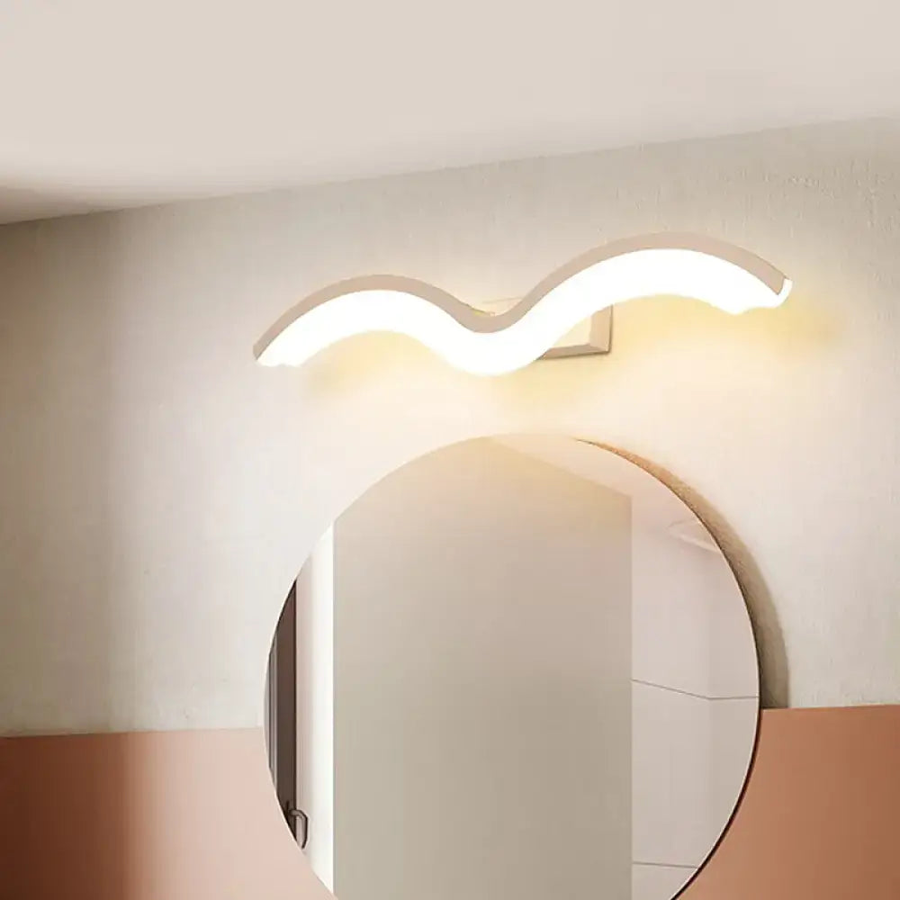 Modern wavelet black and white wall sconce with smooth white curved design and warm ambient LED lighting for bathroom