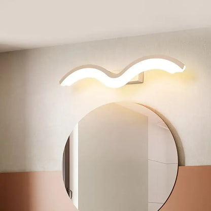 Modern wavelet black and white wall sconce with smooth white curved design and warm ambient LED lighting for bathroom