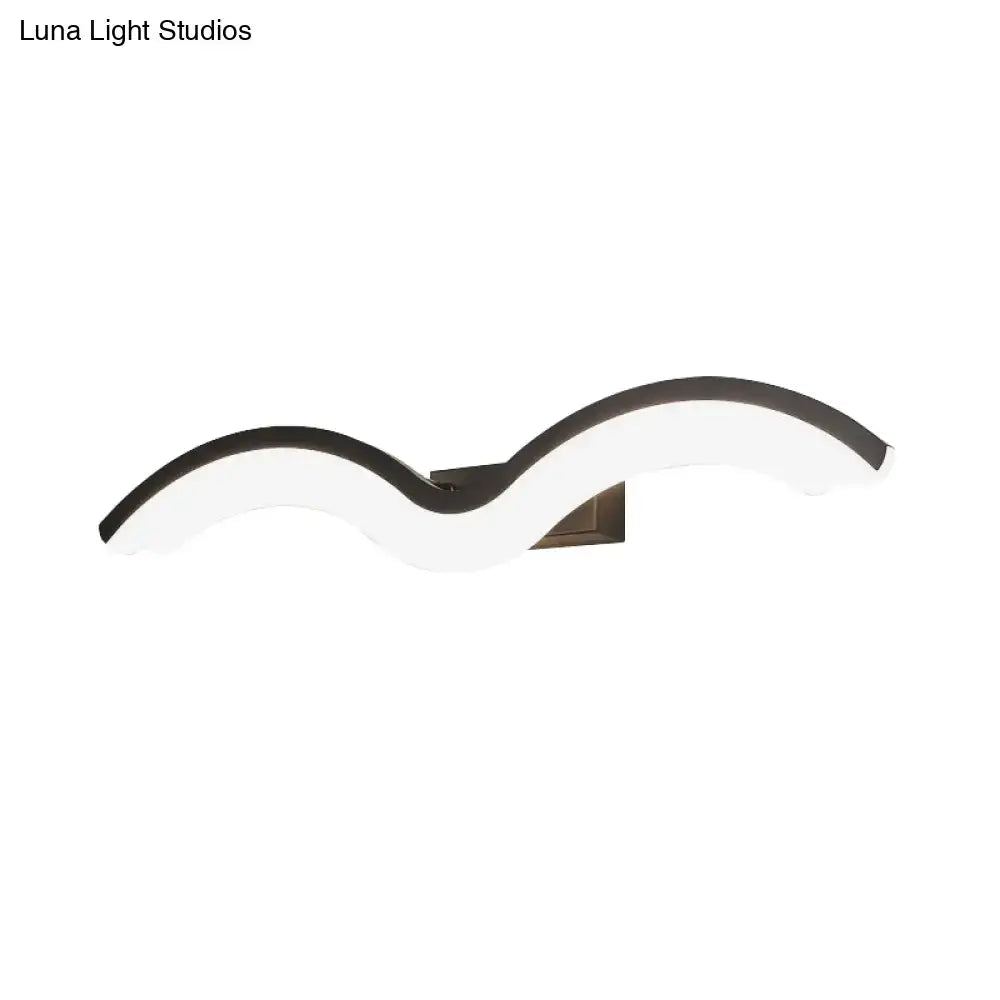Modern wavelet black and white wall sconce with an acrylic diffuser and bronze metal base for bathroom LED lighting