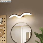 Modern wavelet black and white wall sconce bathroom led light with sleek white illuminated body and dark metallic bracket