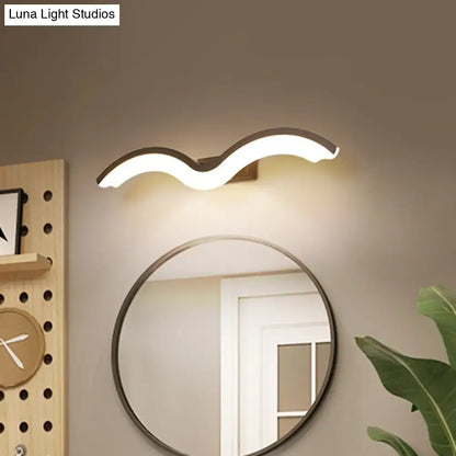 Modern wavelet black and white wall sconce bathroom led light with sleek white illuminated body and dark metallic bracket