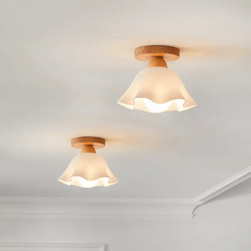 Two warm-toned ruffled glass lampshades with wooden fixtures in a modern decorbites led wood ceiling lamp