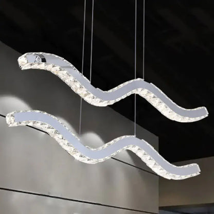 Modern crystal-encrusted wave-shaped hanging light fixture with stainless steel frame for minimalistic office use