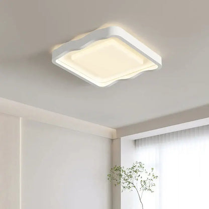 Modern wavy white cream style ceiling lamp with softly curved edges and warm diffused glow for living room decorbites cream style led