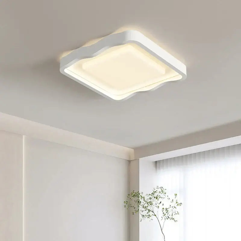 Modern wavy white cream style ceiling lamp with softly curved edges and warm diffused glow for living room decorbites cream style led