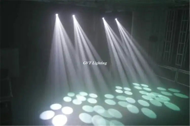 Modern white 150w gobo led moving head stage lights project circular green and white patterns on a dark event stage floor