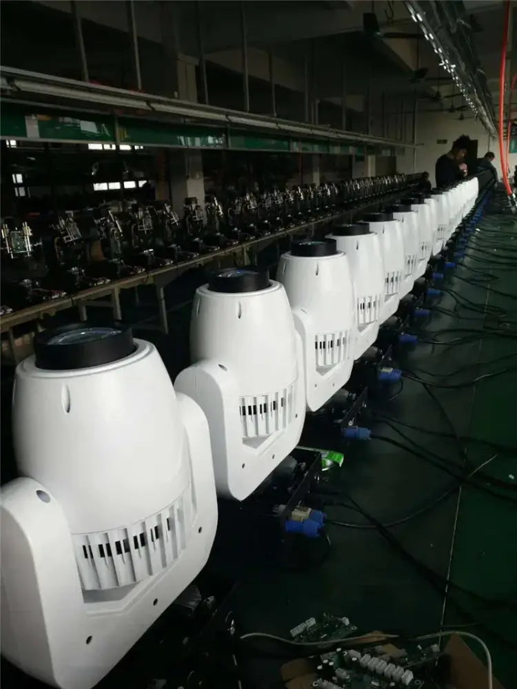 White 150w gobo led moving head stage lights with black tops and ventilation slits arranged in a row on assembly line