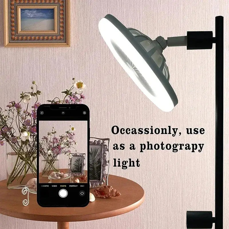 Modern black adjustable desk lamp with circular led light panel paired with modern white 2-in-1 ceiling fan remote control