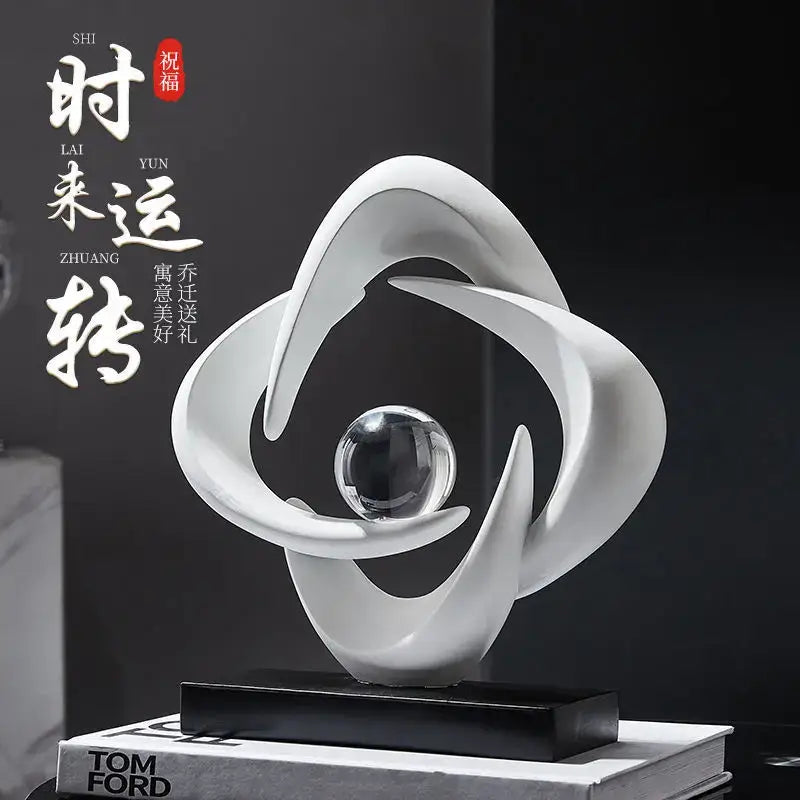 Modern white abstract resin sculpture with flowing curves and a glass sphere on black base for living room decorbites abstract resin decor