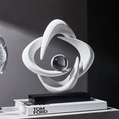Modern white abstract resin sculpture with flowing curves and a clear glass sphere for living room decorbites decor