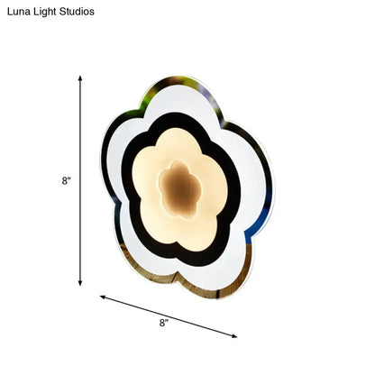 Modern white acrylic cloud wall lamp with concentric rings and warm ambient lighting for bedroom use