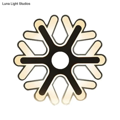 Modern snowflake-shaped led ceiling light with sleek black and cream design complementing white acrylic wall lamp style