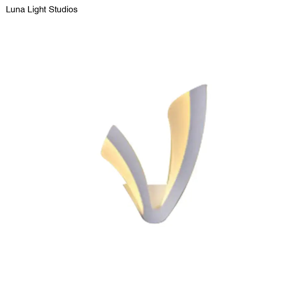 Modern v-shaped wall lamp with white acrylic cloud led shade and sleek silver and warm gold metallic finishes for bedroom