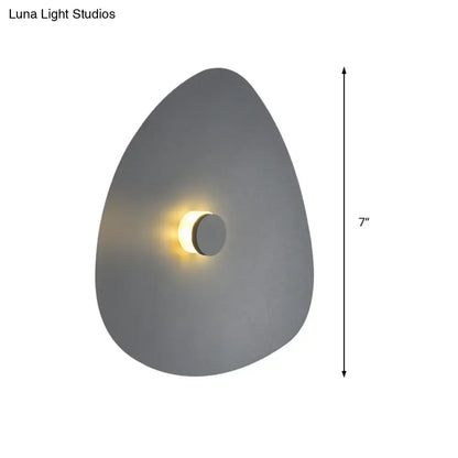 Modern gray teardrop-shaped flaky sconce light with warm circular light for bedroom wall fixture in white acrylic