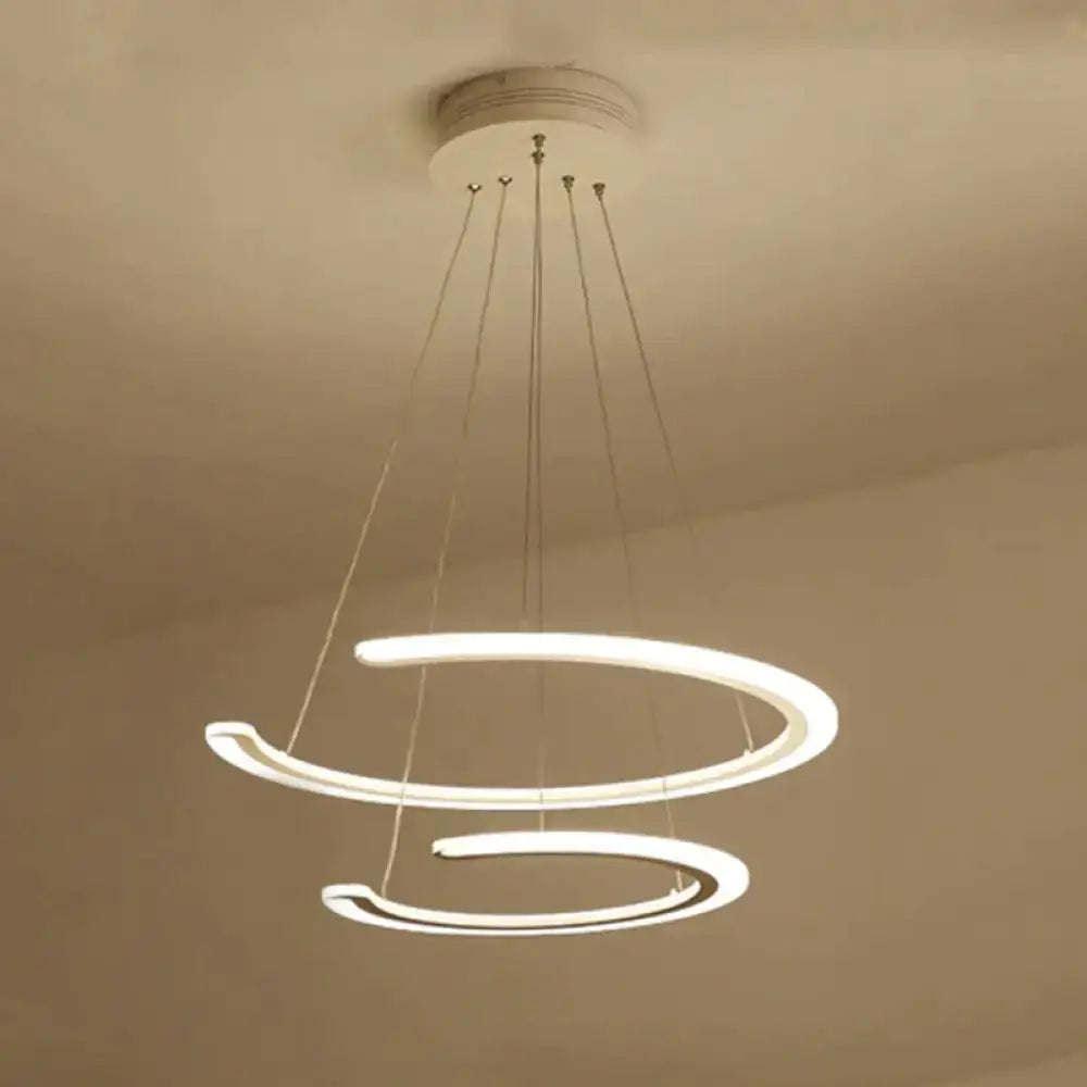 Modern white acrylic led ring dining room chandelier with two interlocking circular rings suspended by thin cords