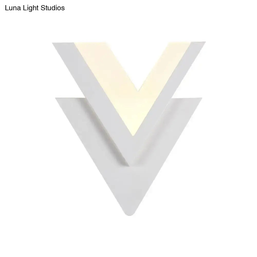 Modern white acrylic sconce light with v-shaped design and warm white glow for bedroom light fixture