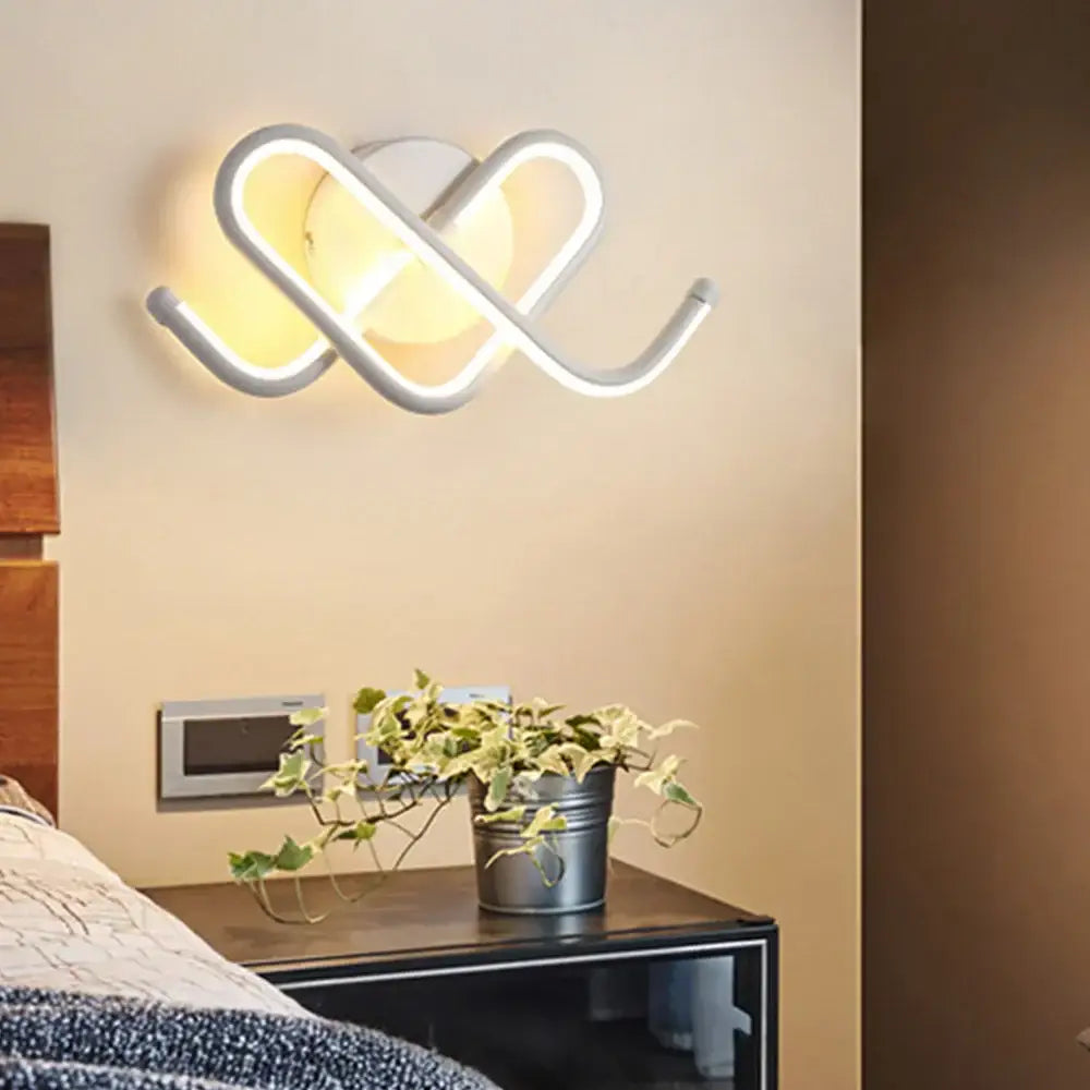 Modern white acrylic led wall sconce light with sleek intertwined loop design for bedroom and corridor decorbites led wall