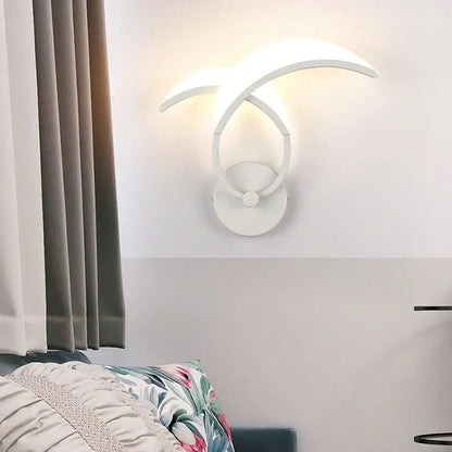 Modern white acrylic led wall sconce light with sleek curved arms emitting warm glow for bedroom corridor decorbites led wall