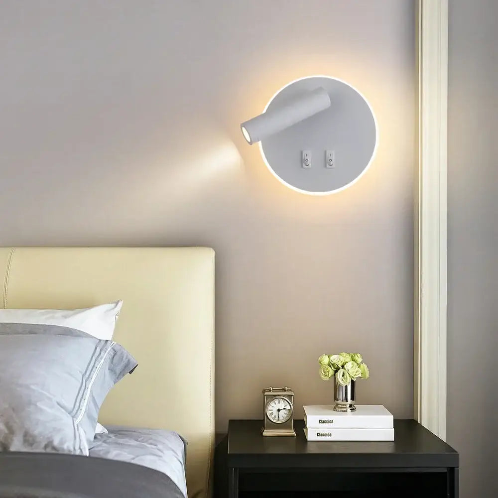 Modern white adjustable 10w wall light sconce with circular design and sleek spotlight for bedroom reading decorbites