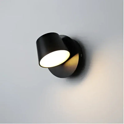 Black cylindrical wall-mounted led wall lamp with sleek modern design for bedroom and living room lighting
