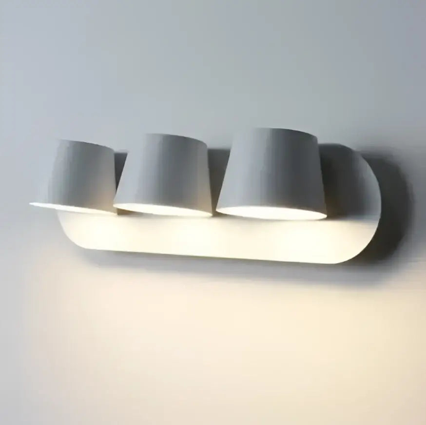 Modern white adjustable led wall lamps with three cylindrical shades mounted on wall for living room and bedroom use
