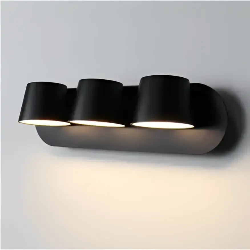 Black matte finished wall lamps with three cylindrical led lamps ideal for bedroom and living room lighting